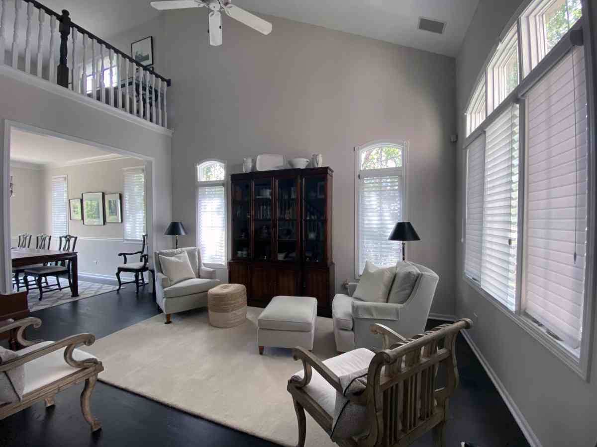 Linda Garza 2 Contemporary living room with sofa, coffee table, and sheer shades near Chicagoland, IL.
