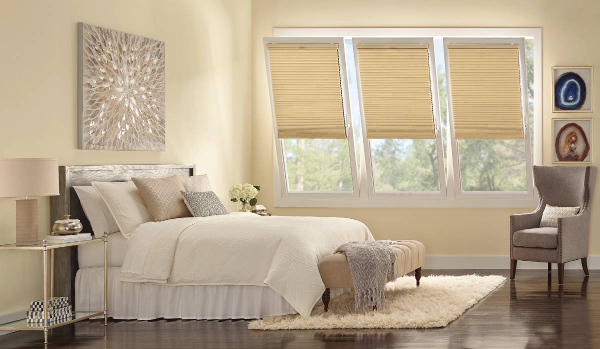 Bedroom 1 Duette® Cellular Shades covering three tilt and turn windows in a bedroom near Chicagoland, IL