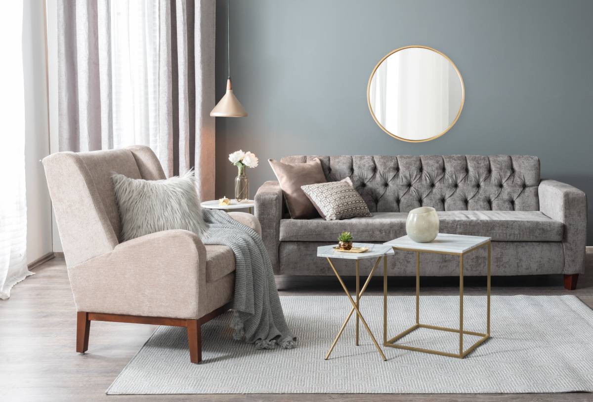 Products & Services 5 Custom drapery in a modern living room with a tufted sofa and armchair at Beyond Shades near Chicagoland